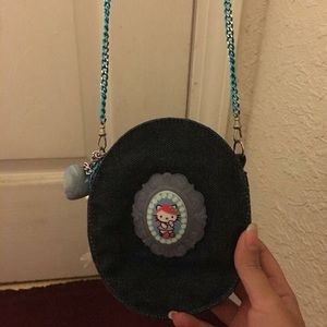 Tarina Tarantino x Hello Kitty pink head purse